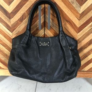 Kate Spade shoulder bag with zipper enclosure.